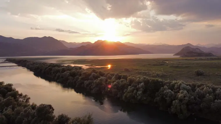 Sunset over the river and the lake