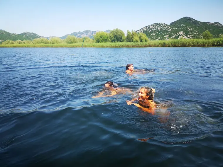 Swimming in the clear water of Skadar Lake
