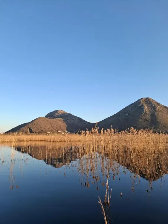 Mountains reflected in the still lake