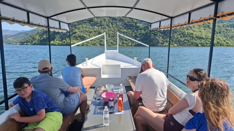 Guests relaxing together on the covered boat
