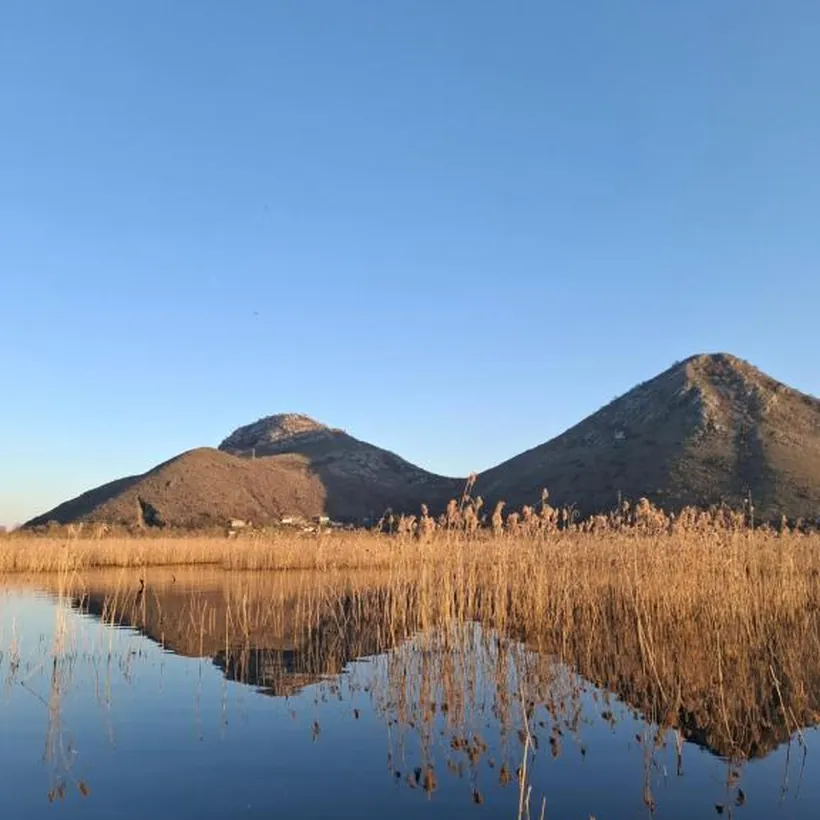 Mountains mirrored in the still water
